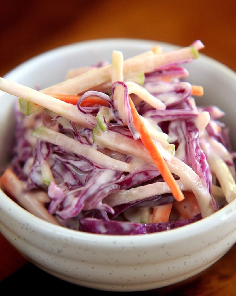 Purple Coleslaw in a white bowl